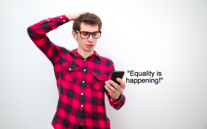 Person looking concerned at phone, which is saying, "Equality is happening!"