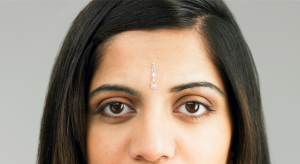A forehead close-up of a person wearing a bindi.